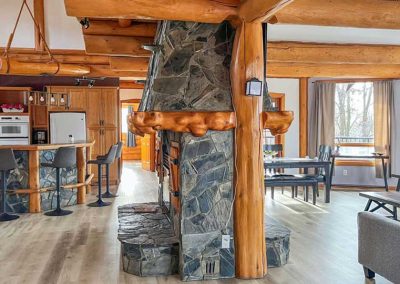 Private Log Chalet - Living room with couches and fireplace